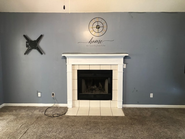 room details with a tiled fireplace, carpet, and baseboards