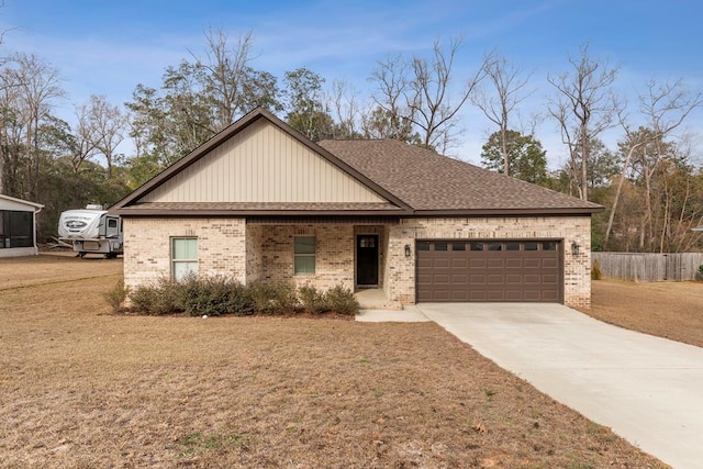 view of front of home featuring a garage and a front lawn