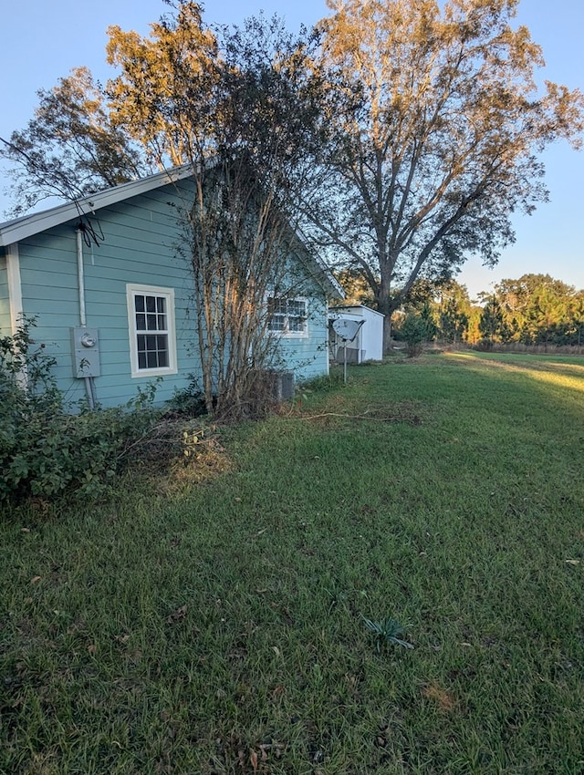 view of home's exterior featuring a lawn