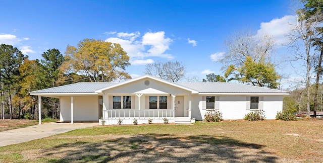 ranch-style home featuring a porch, concrete driveway, a front yard, and metal roof