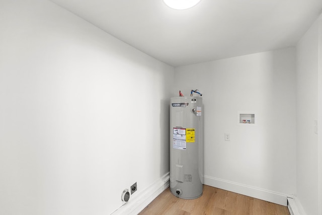 utility room featuring electric water heater