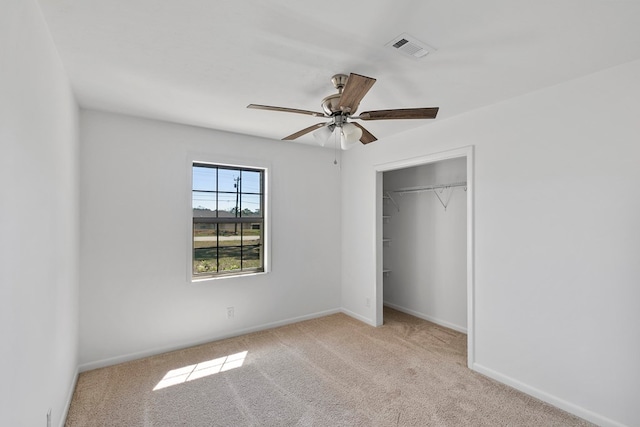 unfurnished bedroom featuring baseboards, visible vents, and carpet floors