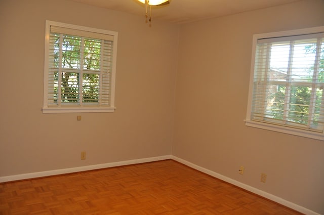 unfurnished room featuring light parquet floors