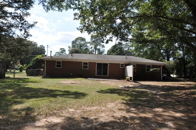 back of house with a yard