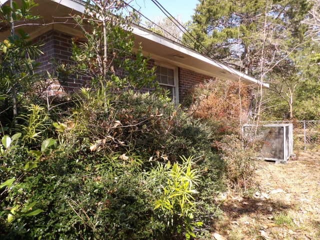 view of home's exterior featuring brick siding