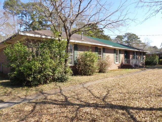 exterior space with brick siding