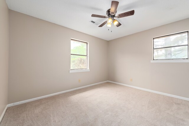 212 Johanna Dr, Ozark, AL 36360 - spare room featuring light colored carpet and a ceiling fan