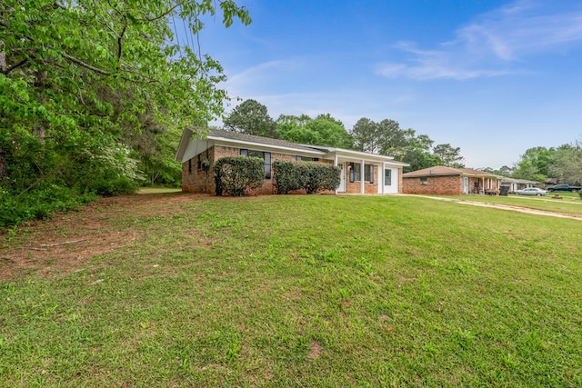 212 Johanna Dr, Ozark, AL 36360 - ranch-style home with brick siding and a front yard