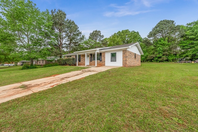 212 Johanna Dr, Ozark, AL 36360 - ranch-style home with brick siding, a front lawn, and a porch