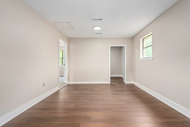 212 Johanna Dr, Ozark, AL 36360 - empty room featuring healthy amount of natural light, dark wood finished floors, and attic access