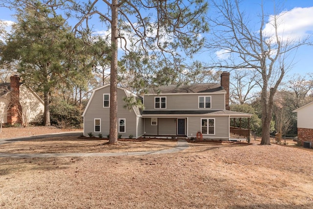 back of house featuring covered porch