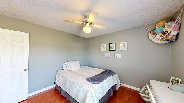 119 Willow Oaks Dr, Headland, AL 36345 - bedroom with baseboards, a ceiling fan, and wood finished floors