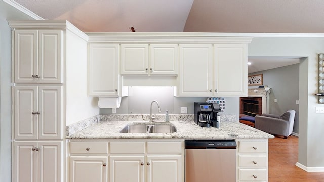 119 Willow Oaks Dr, Headland, AL 36345 - kitchen featuring a sink, white cabinets, light stone countertops, dishwasher, and light wood-style floors