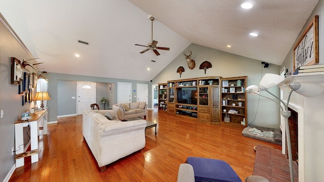 119 Willow Oaks Dr, Headland, AL 36345 - living room featuring wood finished floors, a ceiling fan, high vaulted ceiling, visible vents, and recessed lighting