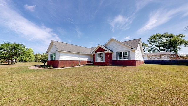119 Willow Oaks Dr, Headland, AL 36345 - ranch-style house featuring fence, a front lawn, and brick siding