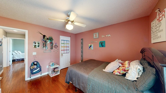 119 Willow Oaks Dr, Headland, AL 36345 - bedroom with ceiling fan, wood-type flooring, and baseboards