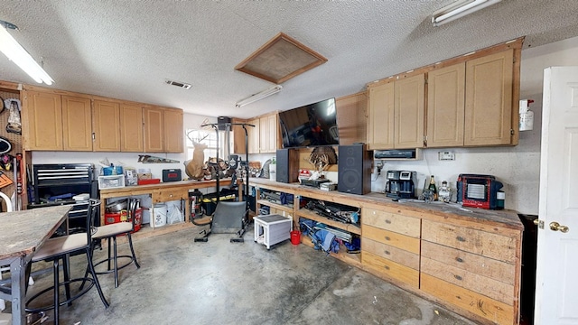 119 Willow Oaks Dr, Headland, AL 36345 - kitchen featuring a textured ceiling, visible vents, and unfinished concrete flooring