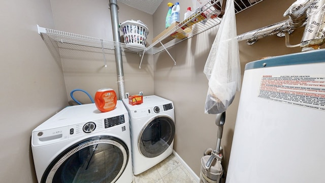 119 Willow Oaks Dr, Headland, AL 36345 - laundry room featuring separate washer and dryer, laundry area, tile patterned flooring, and baseboards