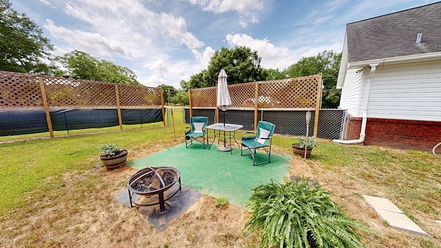 119 Willow Oaks Dr, Headland, AL 36345 - view of yard with a fenced backyard and an outdoor fire pit