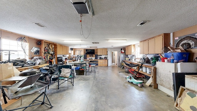 119 Willow Oaks Dr, Headland, AL 36345 - garage with a workshop area and visible vents