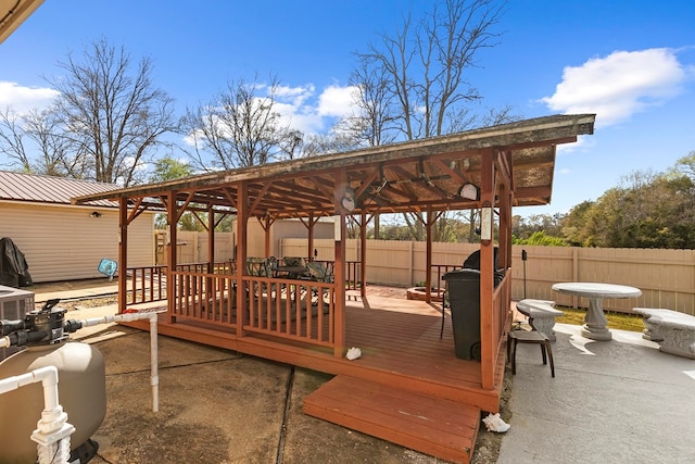 view of patio / terrace with a gazebo, a fenced backyard, and a wooden deck