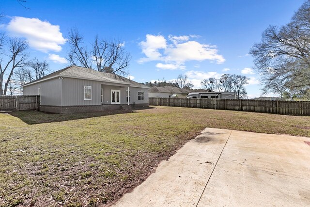 view of yard with a patio area and a fenced backyard