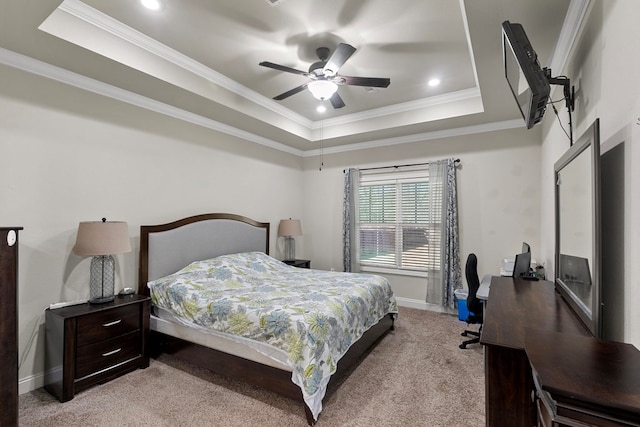 bedroom featuring a raised ceiling, light carpet, and crown molding