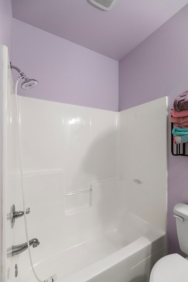 full bath with washtub / shower combination, visible vents, and toilet