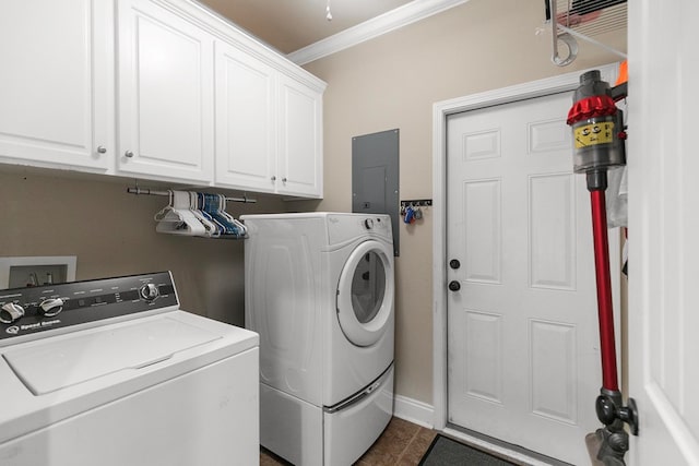 laundry room featuring baseboards, washer and dryer, ornamental molding, electric panel, and cabinet space