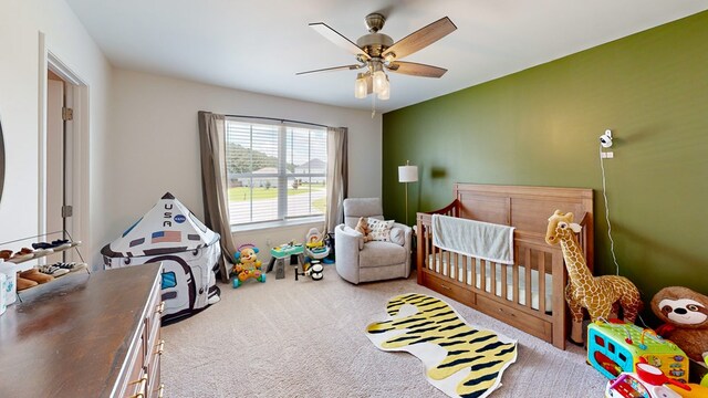 469 Lantana Ct, Rehobeth, AL 36301 - carpeted bedroom featuring a crib and a ceiling fan