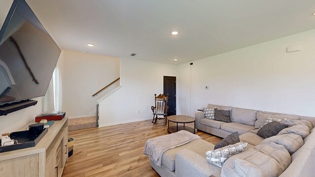 469 Lantana Ct, Rehobeth, AL 36301 - living area with light wood-type flooring, recessed lighting, stairs, and baseboards