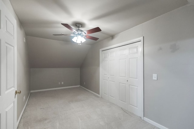 bonus room with light carpet, ceiling fan, and lofted ceiling