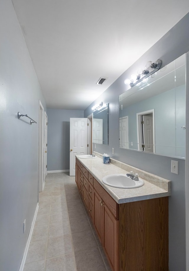 bathroom featuring tile patterned floors and vanity