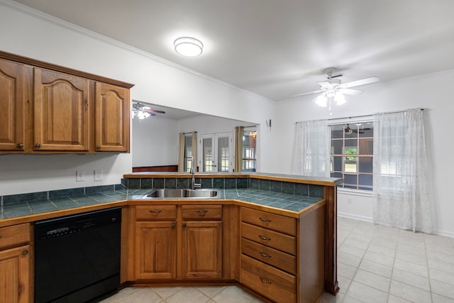 kitchen with kitchen peninsula, ceiling fan, sink, dishwasher, and light tile patterned flooring