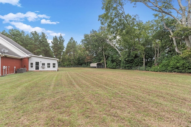 view of yard with central AC unit