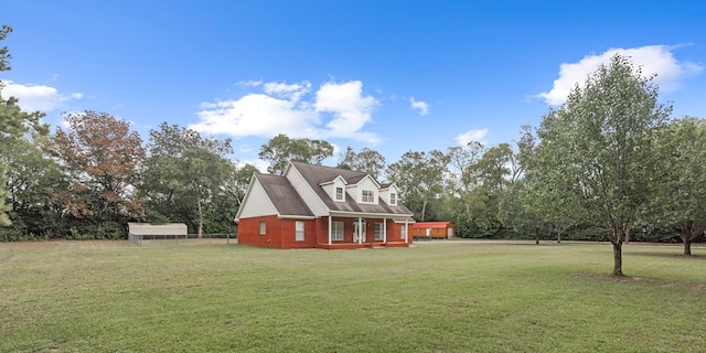 view of front of home featuring covered porch and a front yard