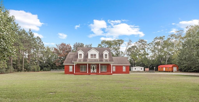 view of home's exterior with covered porch and a yard