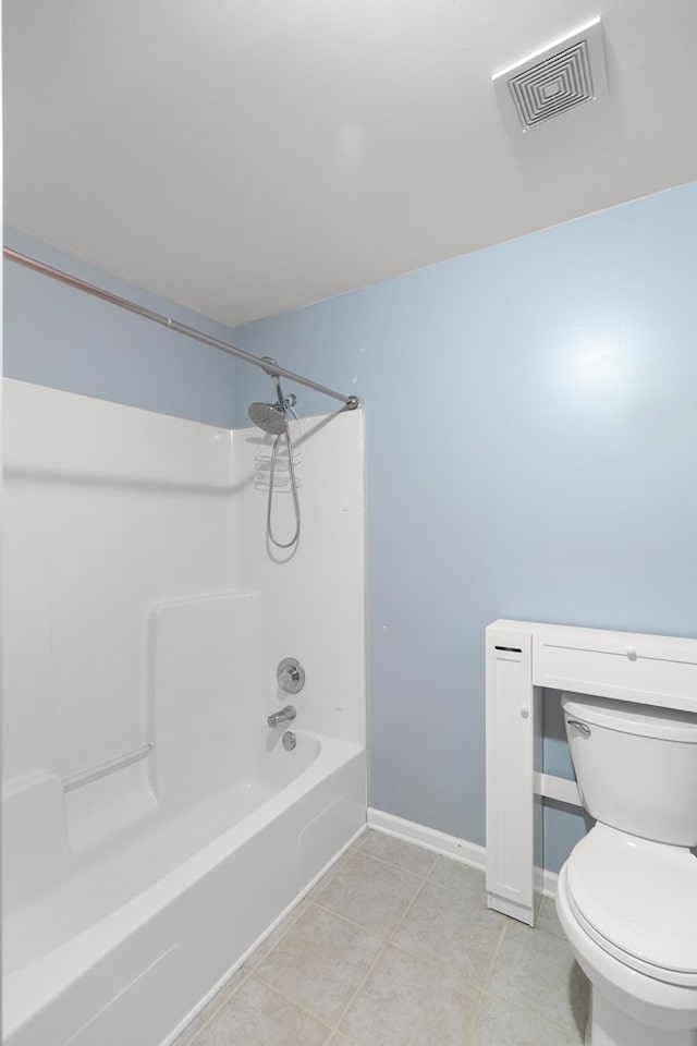 bathroom featuring tile patterned floors, toilet, and shower / bathtub combination