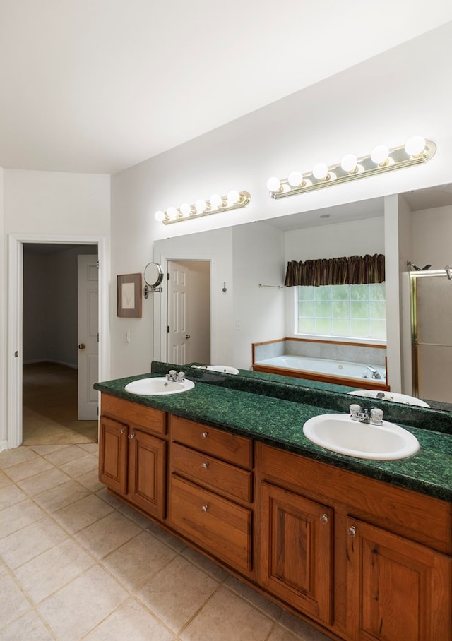 bathroom featuring tile patterned floors, vanity, and plus walk in shower