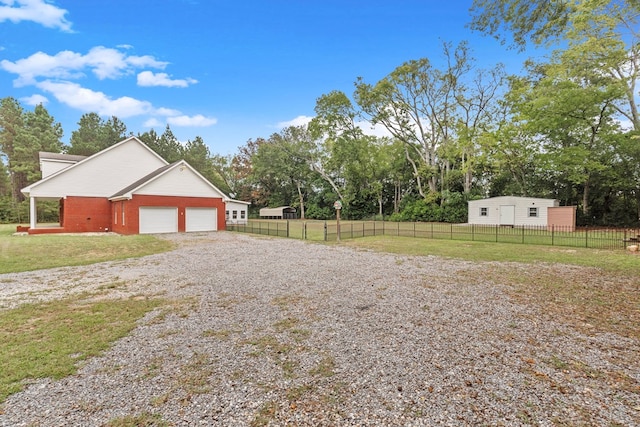 view of yard featuring a garage