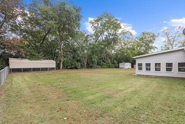 view of yard with an outdoor structure