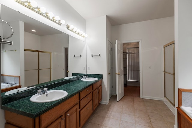 bathroom featuring shower with separate bathtub and vanity