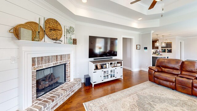 160 Sandbed Rd, Newton, AL 36352 - living room featuring wood finished floors, a tray ceiling, ornamental molding, a ceiling fan, and recessed lighting