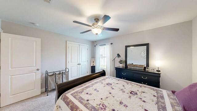 160 Sandbed Rd, Newton, AL 36352 - bedroom with light carpet, a closet, and ceiling fan