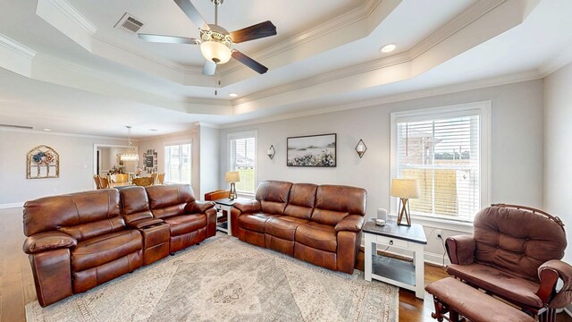 160 Sandbed Rd, Newton, AL 36352 - living room with a raised ceiling, healthy amount of natural light, ceiling fan, ornamental molding, and wood finished floors