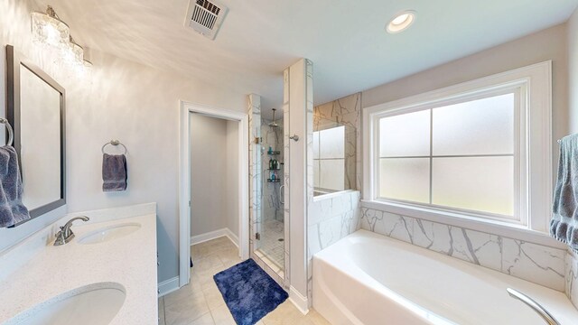 160 Sandbed Rd, Newton, AL 36352 - full bathroom with a bath, a shower stall, double vanity, and tile patterned floors