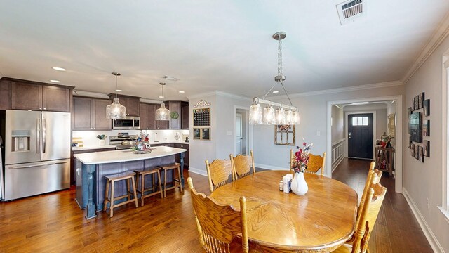 160 Sandbed Rd, Newton, AL 36352 - dining room featuring dark wood-type flooring, recessed lighting, and crown molding