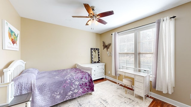 bedroom with hardwood / wood-style floors and ceiling fan