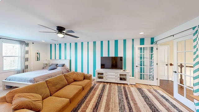 bedroom with hardwood / wood-style flooring and ceiling fan