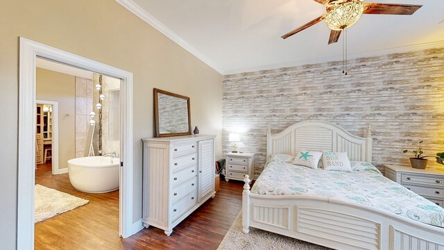 bedroom featuring crown molding, wood-type flooring, ceiling fan, and ensuite bath